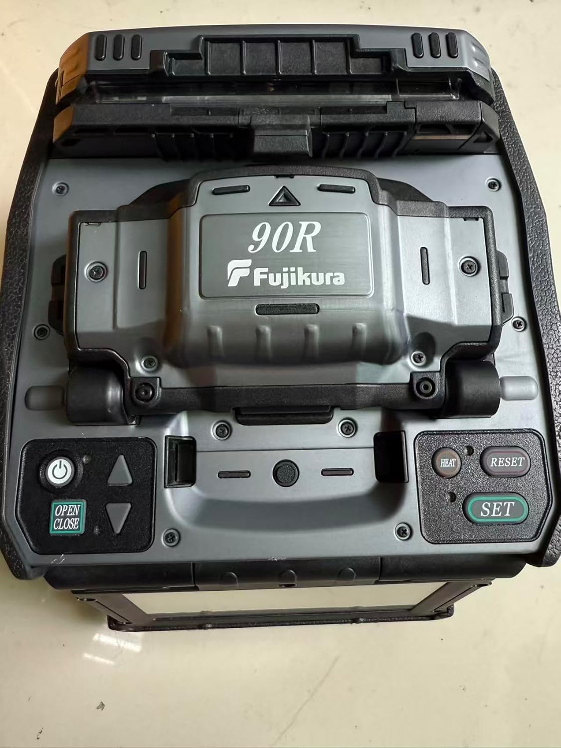buy Fujikura FSM-90R fusion splicer,Fujikura 90R mass fusion splicer pros cons,FSM-90R vs Sumitomo ribbon splicer,Fujikura 90R specifications,ribbon fusion splicer worth buying,Fujikura 90R arc count performance testing and real-world results