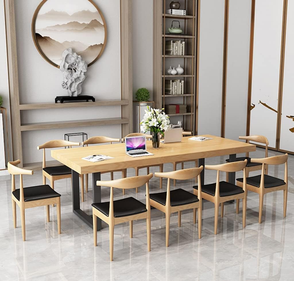 Real-world testing of the solid wood office desk under heavy load with dual monitors, PC, and peripherals, demonstrating its stability and capacity